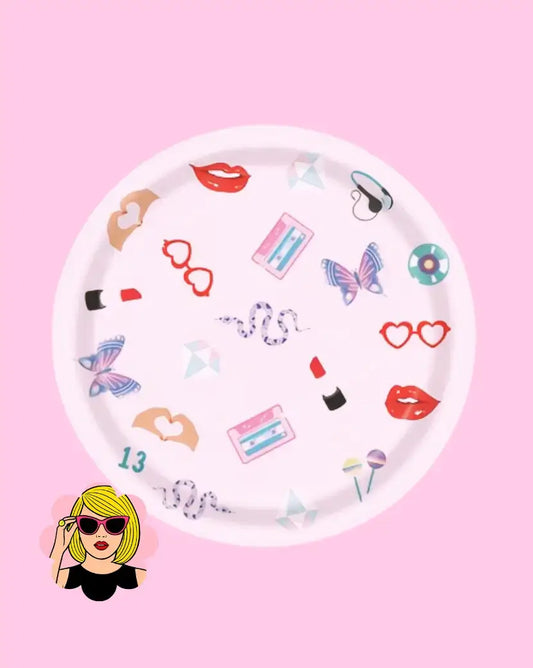 Decorative paper plate with colorful icons on a pink background