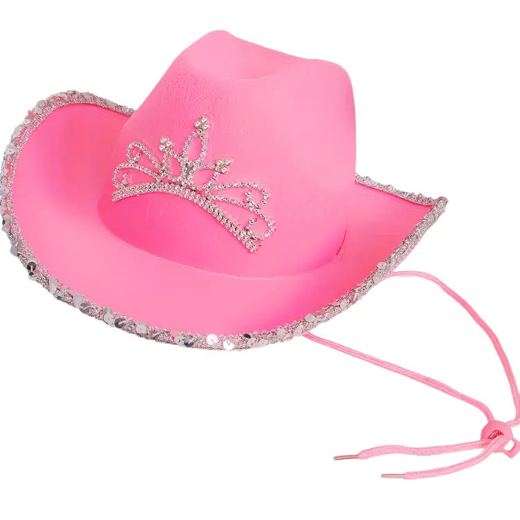 Pink cowboy hat with rhinestone tiara on a white background