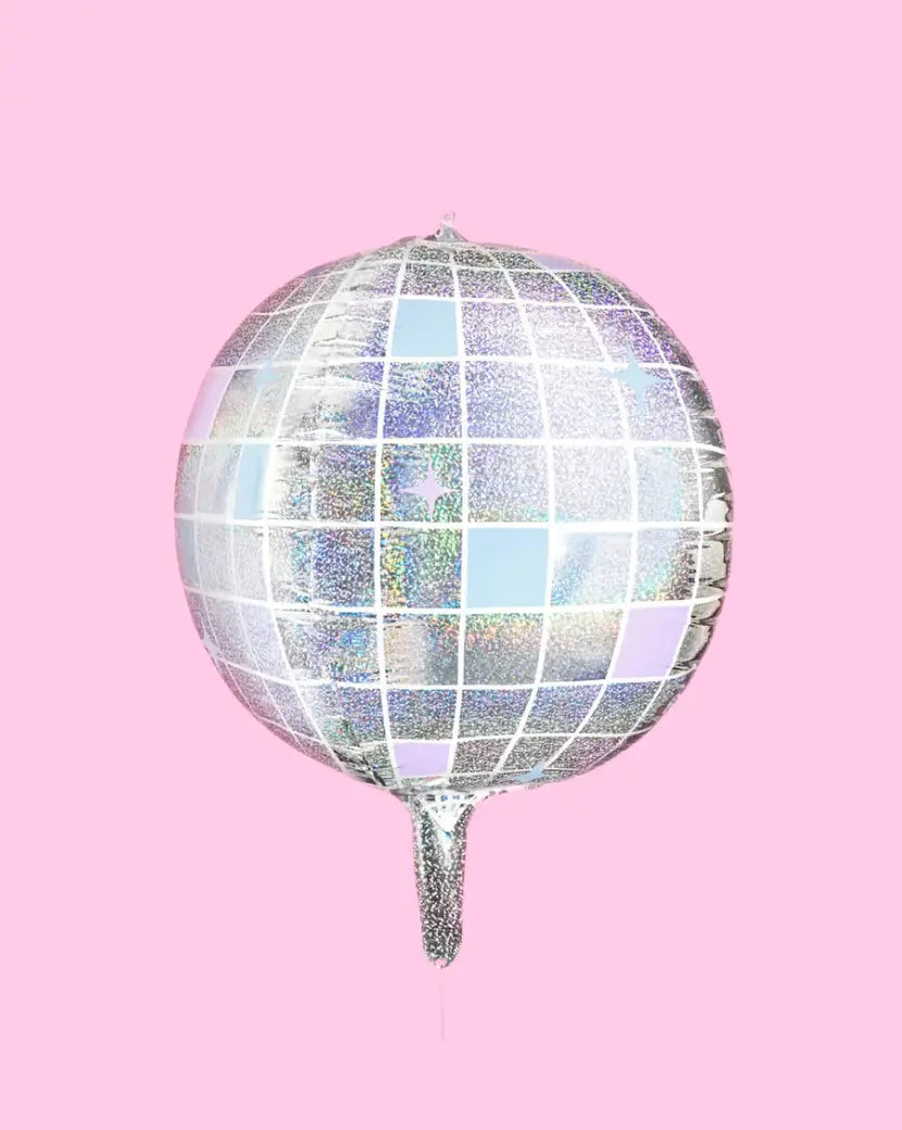 Iridescent disco ball balloon on a pink background