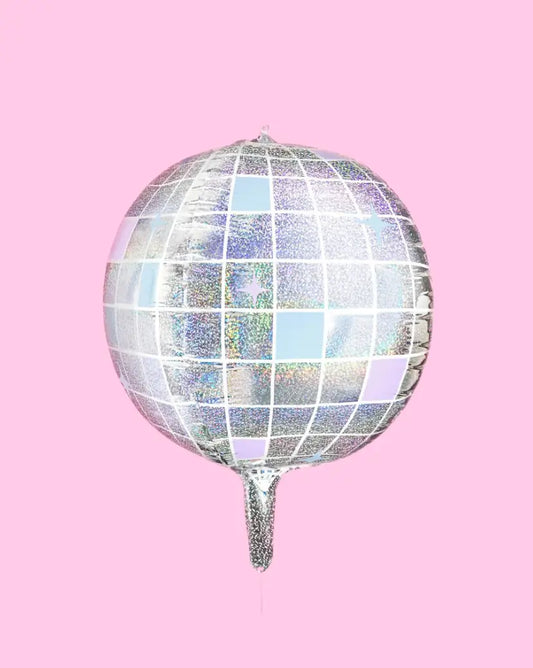 Iridescent disco ball balloon on a pink background