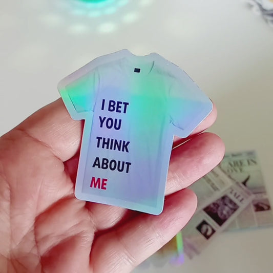 Holographic Taylor Swift sticker of the 22 shirt saying I Bet You Think About Me from the Red Era