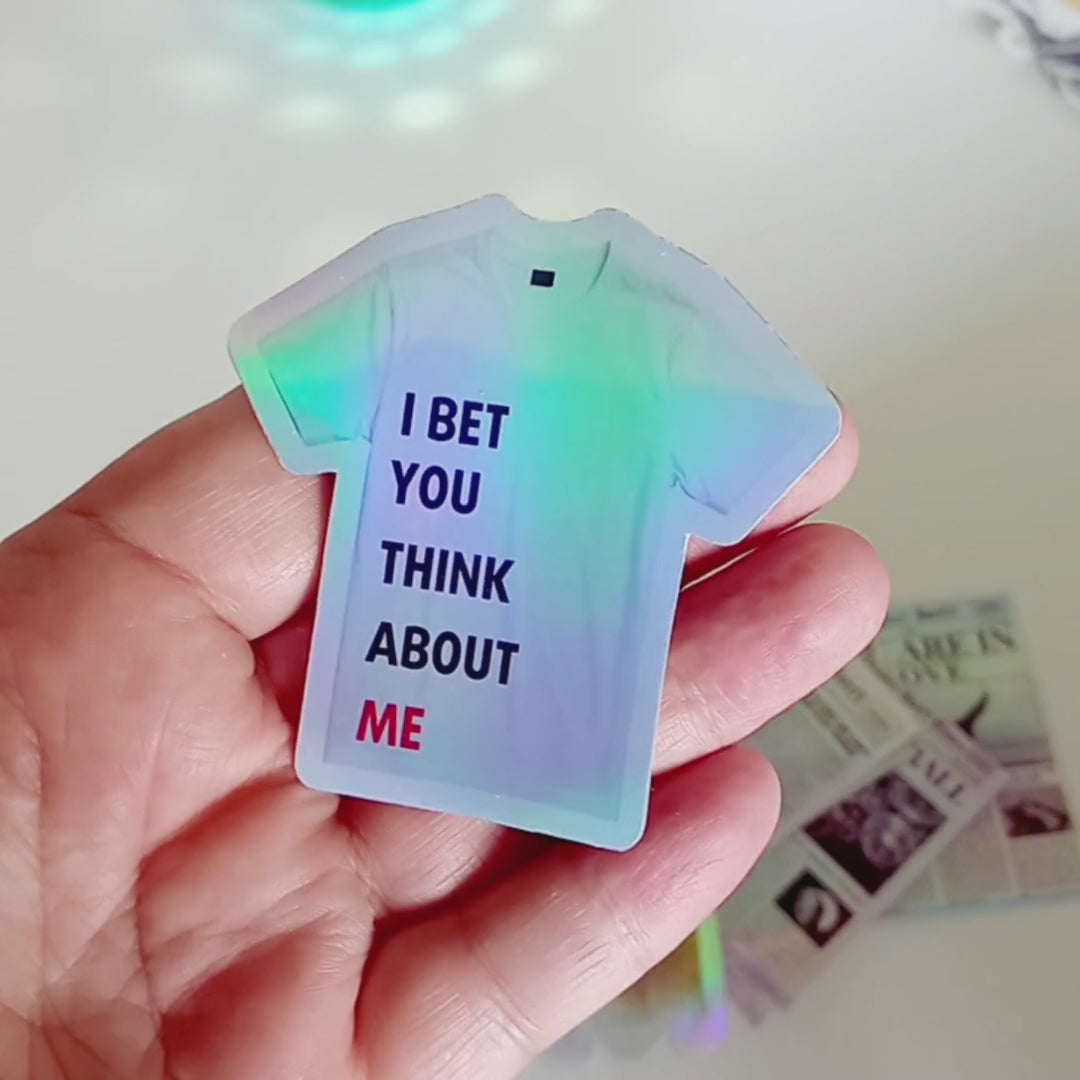 Holographic Taylor Swift sticker of the 22 shirt saying I Bet You Think About Me from the Red Era